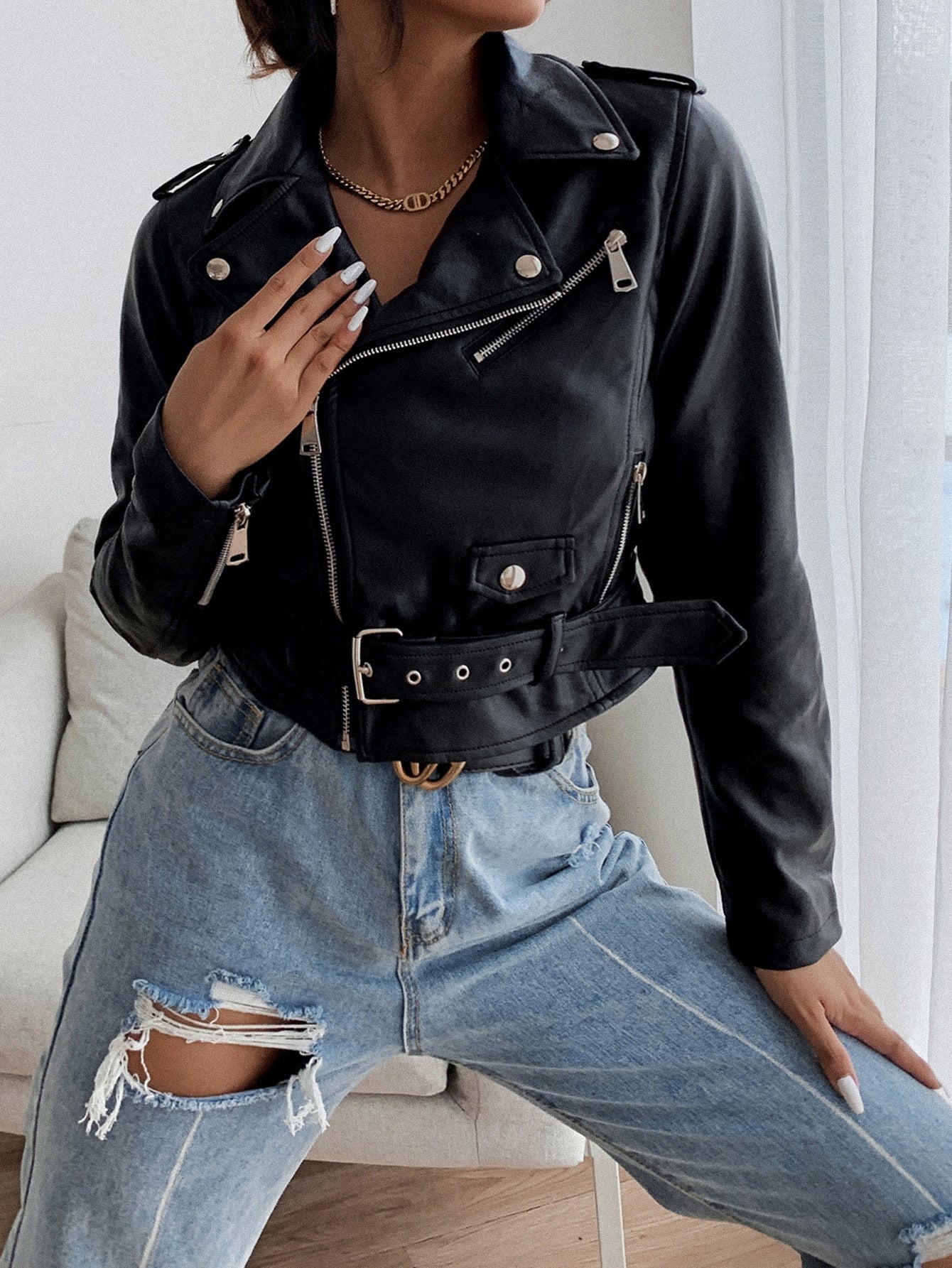 Leather jacket with notched collar, front zipper, and belt