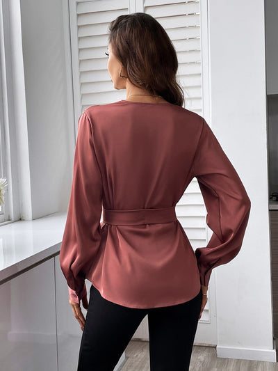 Blouse with belt, asymmetrical hem