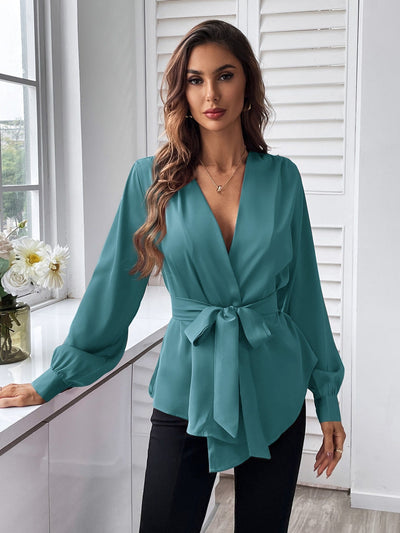 Blouse with belt, asymmetrical hem