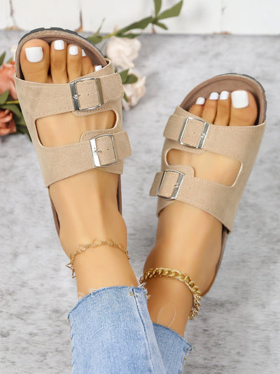 Footbed sandals with buckle decoration